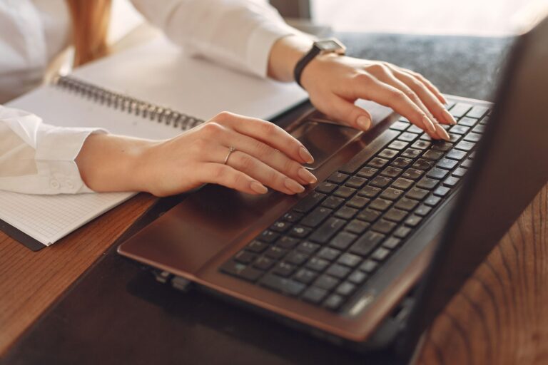 Person typing laptop