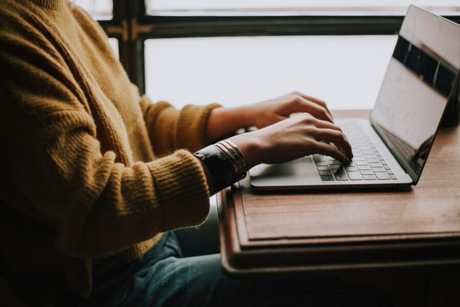 Person typing laptop